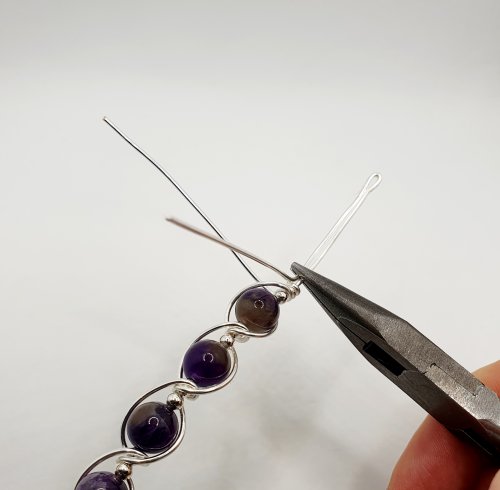 Natalie Patten's Gemstone and Spacer Bead Bangle - , Contemporary Wire Jewelry, Wire Wrapping, Wrapping, Wire Wrapping Jewelry, Beads, , Bend the central wire at this point 