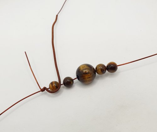 Natalie Patten's Pawprint Pendant and Earrings - , Contemporary Wire Jewelry, Coiling, Coiling Wire, Wire Coiling, Wire Wrapping, Wrapping, Wire Wrapping Jewelry, bend the coil around the first bead