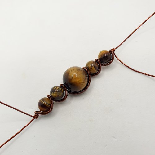 Natalie Patten's Pawprint Pendant and Earrings - , Contemporary Wire Jewelry, Coiling, Coiling Wire, Wire Coiling, Wire Wrapping, Wrapping, Wire Wrapping Jewelry, tighten and adjust the coiled wire