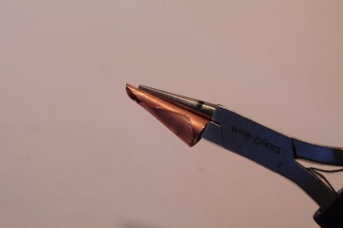 Judy Freyer Thompson's Making Basic End Cones - , Findings & Components, Toggles & Clasps, Earwire & Headpin, Cutting, Cutting Tool, Cutters, How To Punch Holes, Hole Punching, Punch A Hole, Findings, Clasps, Components, Riveting, Riveting Techniques, Wire Rivets, bend the metal around the pliers