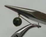 Judy Larson's Wire Wrapped Loops - , Findings & Components, Toggles & Clasps, Earwire & Headpin, Coiling, Coiling Wire, Wire Coiling, Findings, Clasps, Components, Loops, Wire Loop, Wrapped Wire Loop, Wire Wrapping, Wrapping, Wire Wrapping Jewelry, Using Bent nose pliers to finish the wrap on the loop